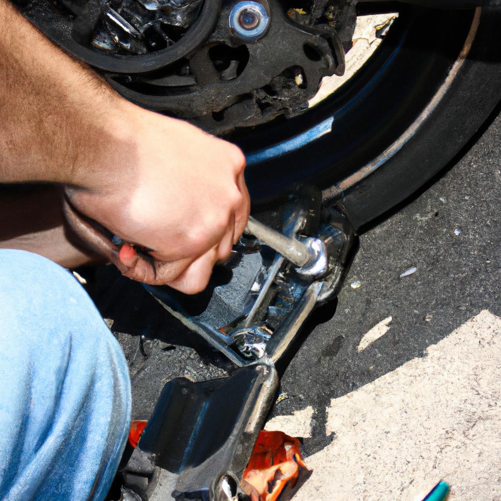 Person working on motorcycle brakes